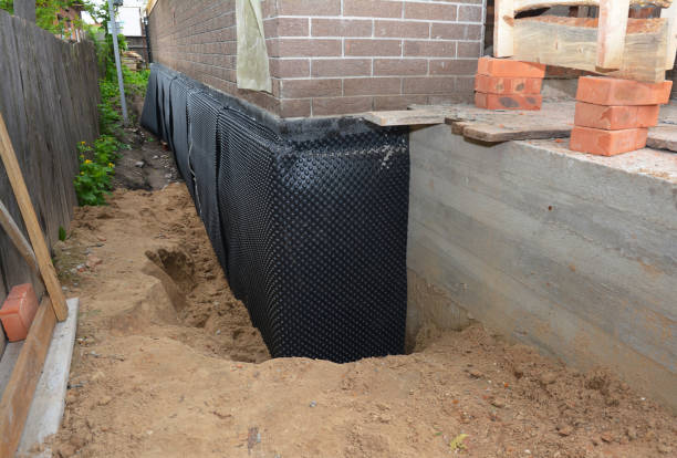 SJ Waterproofing Pros technician performing targeted Waterproofing assessment in Blue Rock, OH
